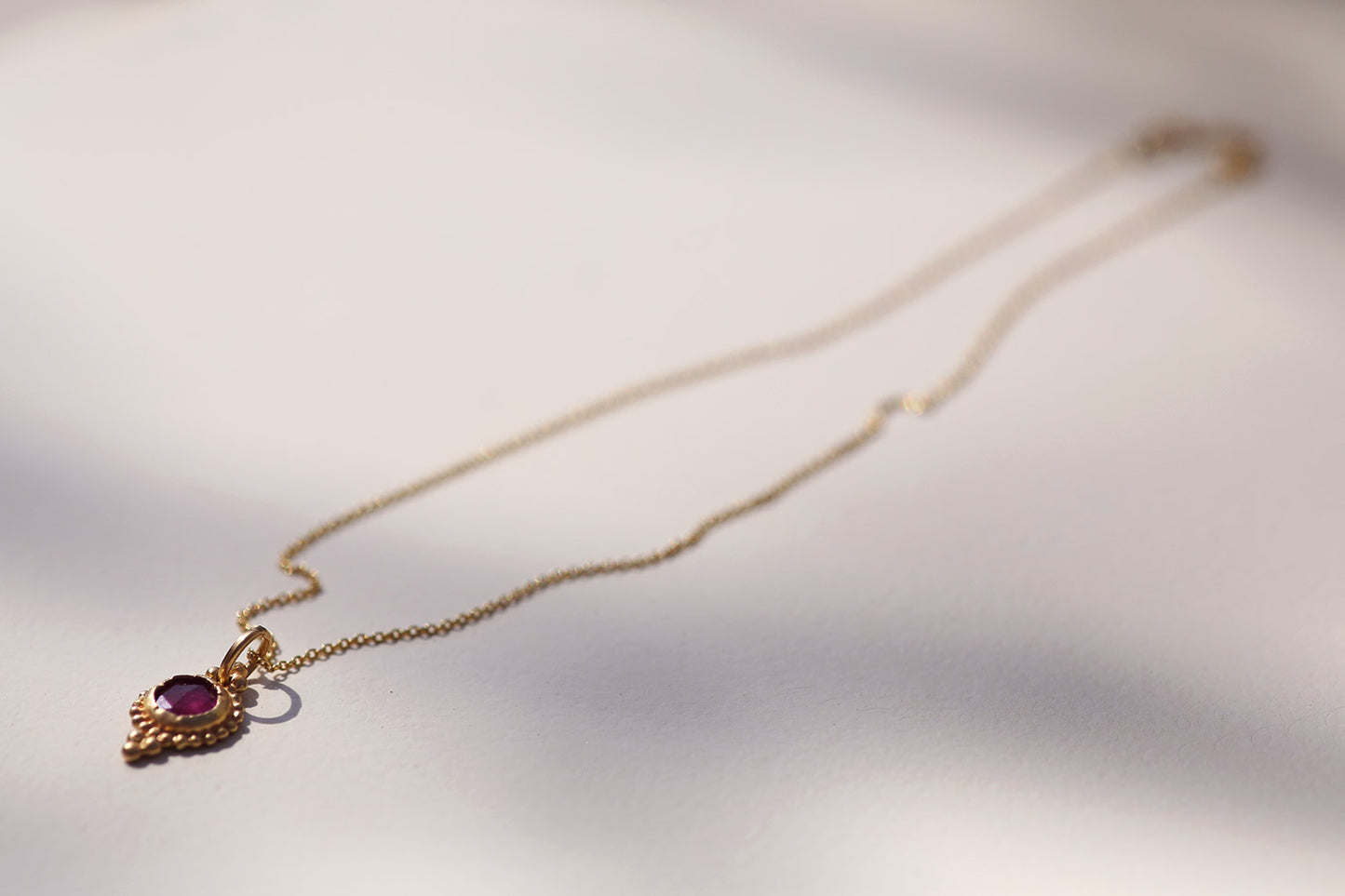 Golden Pendant with Ruby Stone