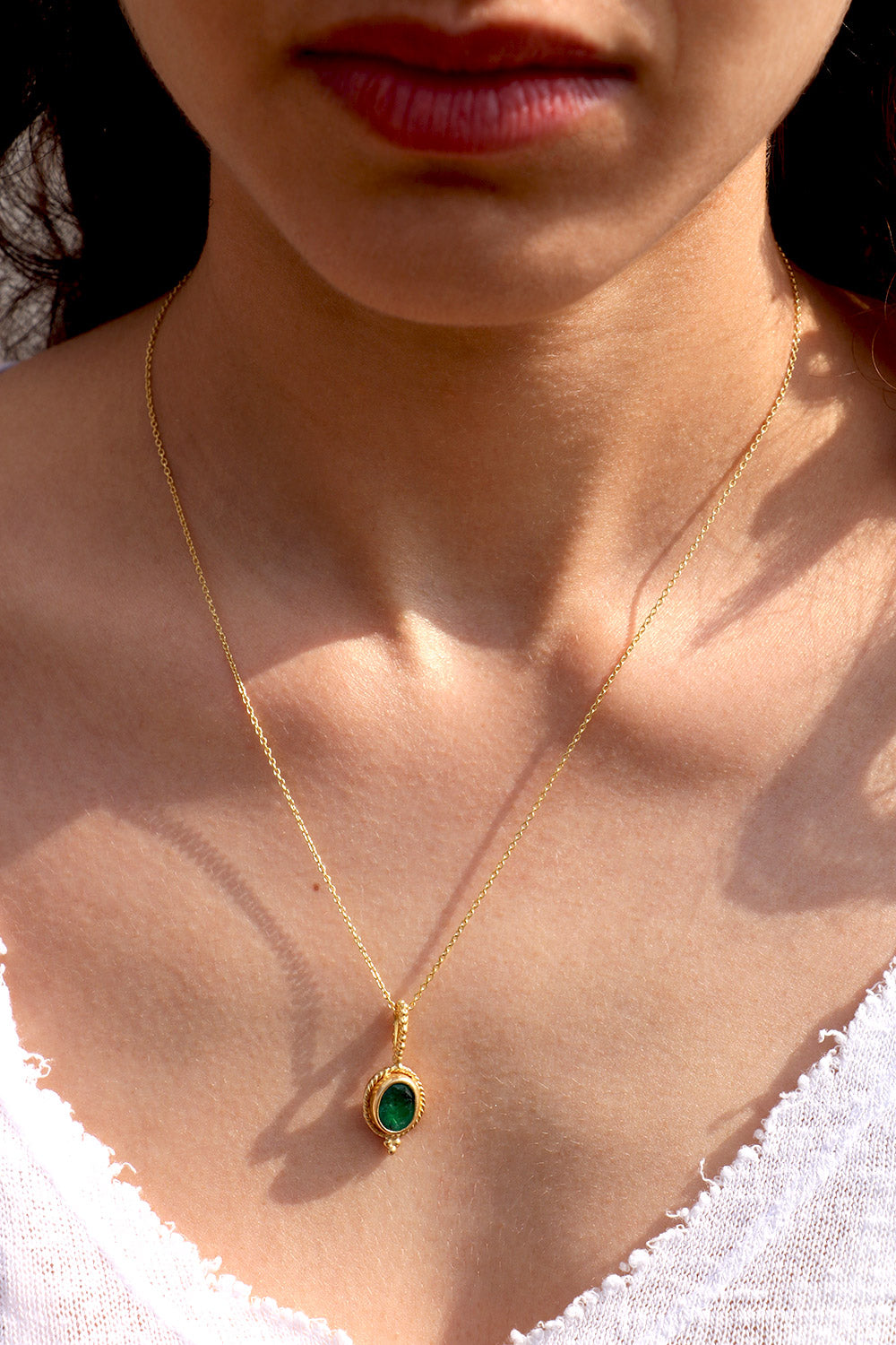 Golden Pendant with Emerald Stone