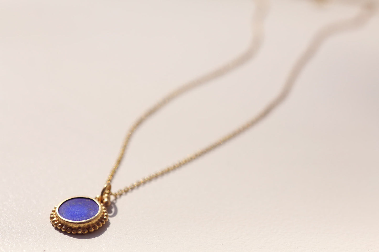 Golden Pendant with Lapis Stone