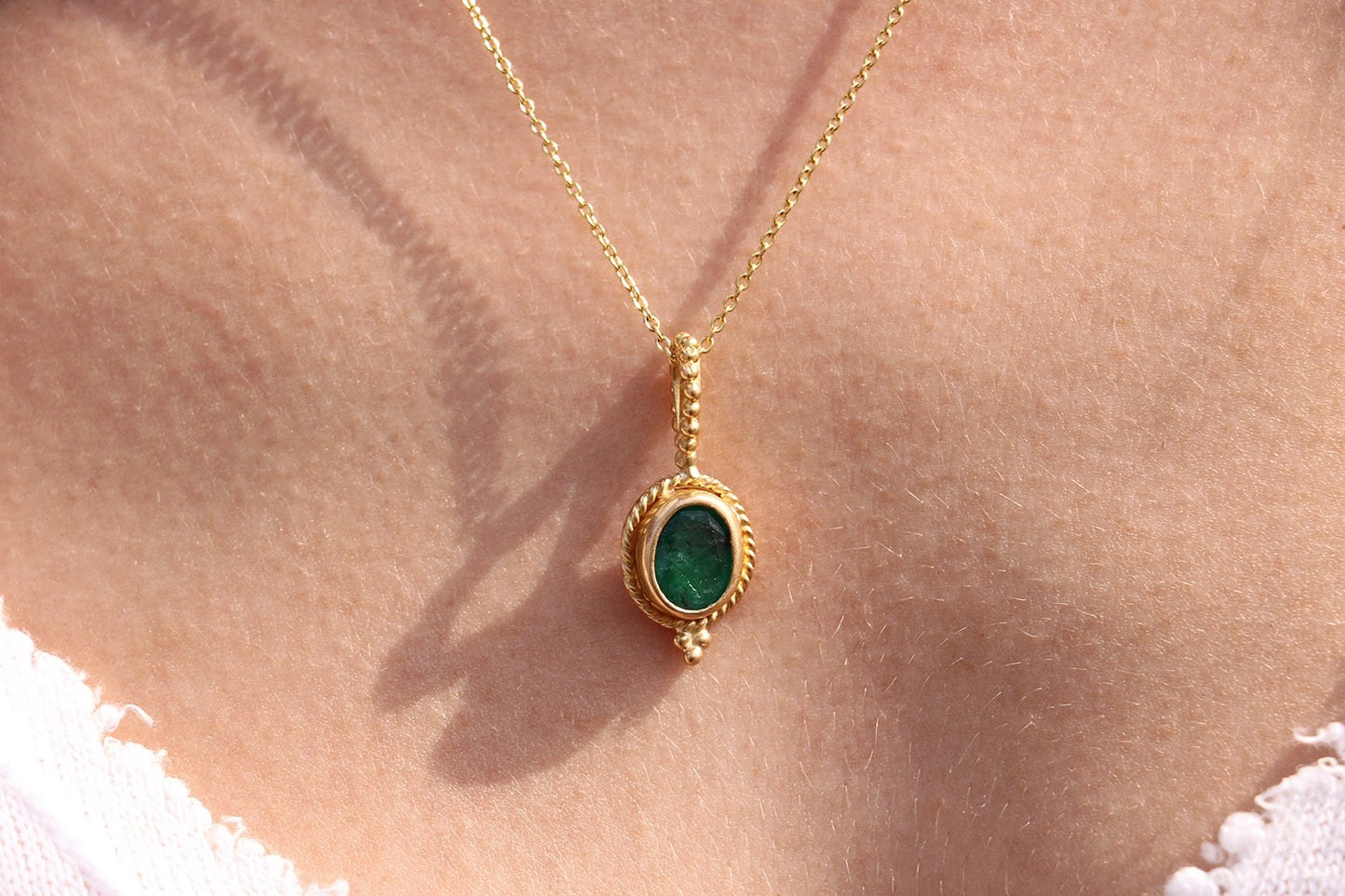 Golden Pendant with Emerald Stone